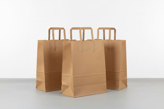 kraft brown take away bags Xtra large with widw base in rectan with internal handles but not twisted handles and no names in the photios and in studi back ground, 