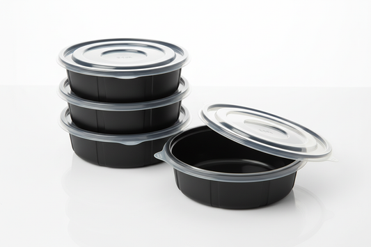 Round Black Base Bowls/Containers (PP) with Lids – 24oz in studio background